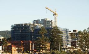 Image of a building site with cranes