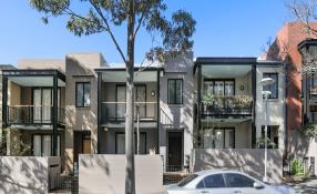 Image of residential building on tree lined street