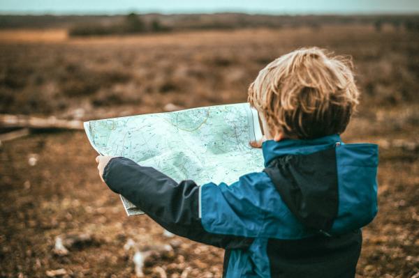 Image of boy holding a map