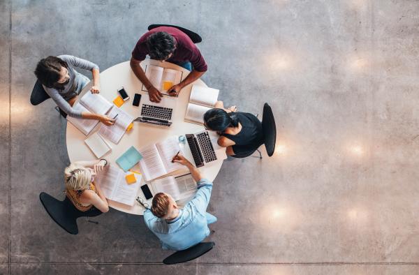 Image of people working at a table 