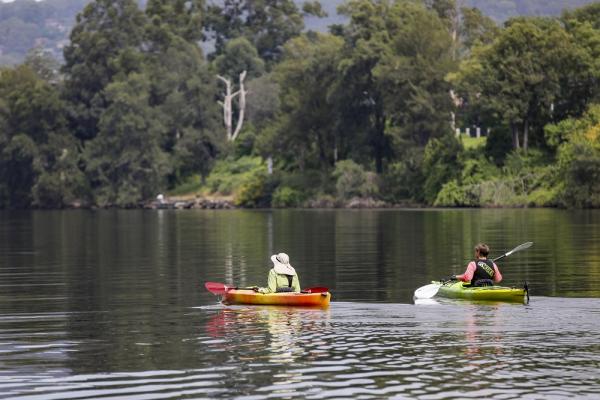 This is an image of two people canoeing on the Nepean River