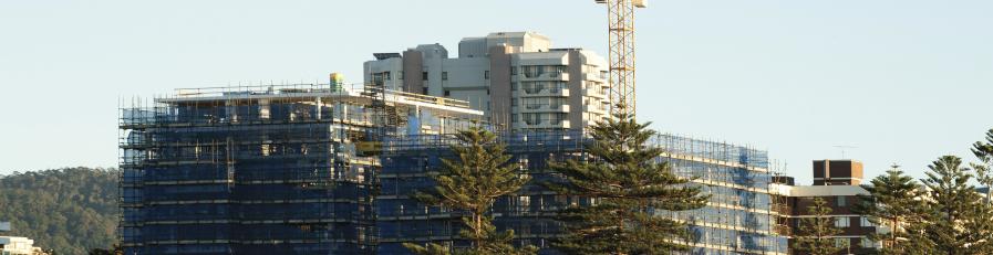 Image of a building site with cranes