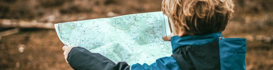 Image of boy holding a map