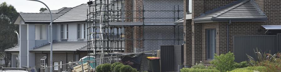 Image of residential brick building with scaffolding