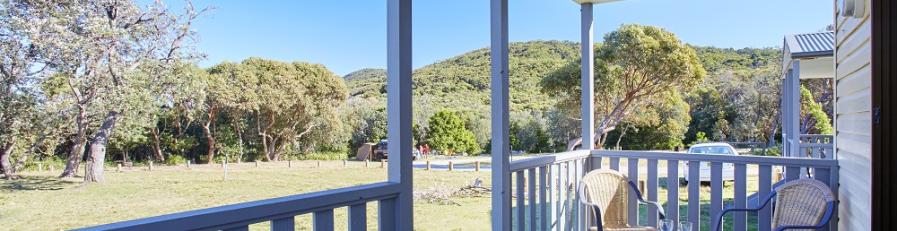 This is in image of table and chairs on a outside balcony