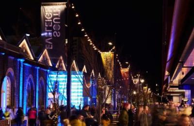 Image of outside night time dining precinct with marquees and fairy lighting